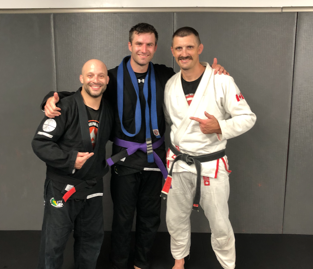 Receiving my purple belt in Brazilian Jiu Jitsu from my coaches Jesse Gough and Rowan Cunningham.